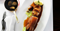 Braised stuffed pig's trotters with cabbage, shallots ... image
