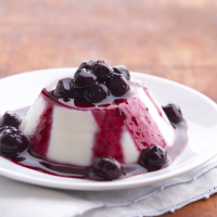 Almond Panna Cotta with Blueberry Sauce Recipe | EatingWell image
