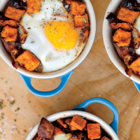 Sweet Potato and Caramelized Onion Hash with Baked Eggs ... image