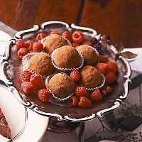 Raspberry Chocolate Truffles Recipe | Land O’Lakes image