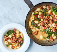Sausage, kale & gnocchi one-pot recipe | BBC Good Food image