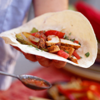 Mixed Fajitas with Peppers and Onions Recipe | MyRecipes image