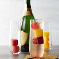Mimosas with Juice Ice Cubes Recipe | EatingWell image