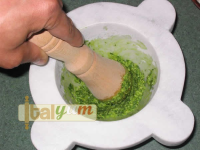 Pesto using pestle and mortar (Pesto alla genovese for the ... image