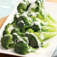 Broccoli with Creamy Parmesan Sauce Recipe | EatingWell image