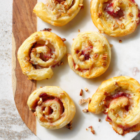 Cranberry Brie Pecan Pinwheels Recipe: How to Make It - Taste of Home: Find Recipes, Appetizers, Desserts, Holiday Recipes & Healthy Cooking Tips image
