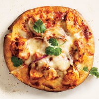 Chicken Tikka Pizzas Recipe | MyRecipes image