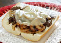 Steak and Cheese Sandwiches with Onions and Mushrooms ... image