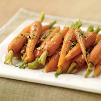 Steamed Carrots with Garlic-Ginger Butter Recipe | MyRecipes image