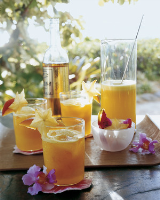 Pineapple and Mango Rum Cocktails Recipe | Martha Stewart image