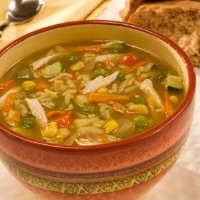 Chicken Rice Vegetable Soup Recipe | MyRecipes image