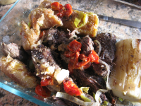 Baho (Beef, Plantains and Yuca Steamed in Banana Leaves ... image