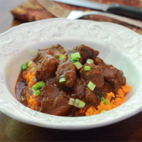 Red Chile Braised Beef Stew over Mashed Sweet Potatoes ... image