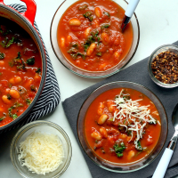 Hearty Tomato Soup with Beans & Greens Recipe | EatingWell image