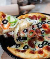 Easy Black Olives Pizza Recipe - Slice Pizzeria image