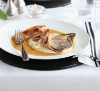 Roast fillet of sea bass with parsnip purée & caramelised ... image