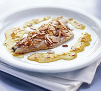 Almond-crusted fish with saffron sauce recipe | BBC Good Food image