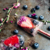 Champagne Popsicles with Berries and Edible Flowers ... image