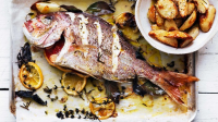 Whole snapper roasted with herbs and potato Recipe | Good Food image