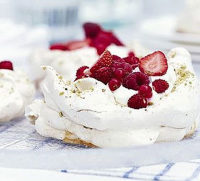Pistachio meringues with summer berries recipe | BBC Good Food image