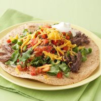 Pressure-Cooker Shredded Beef Tacos Recipe | EatingWell image
