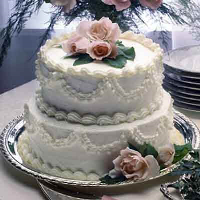 Raspberry Laced Wedding Cake Recipe | Land O’Lakes image