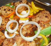 Pork Chops Garnished With Peppers & Onions Recipe - Food.com image