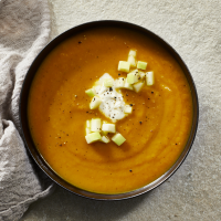Curried Butternut Squash & Apple Soup Recipe | EatingWell image