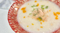 Salt fish congee and Johnny cakes with ginger, garlic ... image