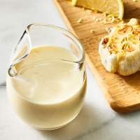 Creamy Lemon-Garlic Dressing Recipe | EatingWell image