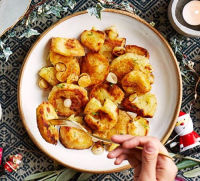 Garlic & rosemary roast potatoes recipe | BBC Good Food image