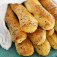 Fluffy Garlic Butter Breadsticks - The Comfort of Cooking image