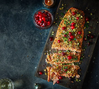 Baked salmon fillet with pickled cranberries, parsley ... image