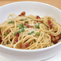 Spaghetti Carbonara with Green Peas Recipe - Food & Wine image