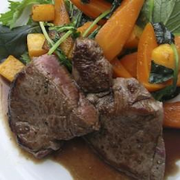 Roasted venison haunch with red wine and rosemary gravy ... image