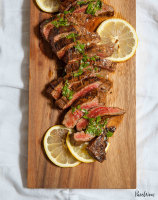 Grilled Flank Steak with Lemon-Herb Sauce - PureWow image