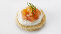 Smoked salmon blini canapés recipe - BBC Food image