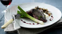 Pigeon breast with red wine gravy, roast leeks and wild ... image