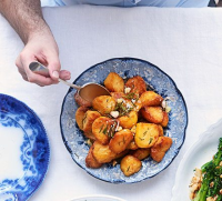 Garlic & rosemary roast potatoes recipe | BBC Good Food image