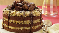 Gingerbread cake with caramel biscuit icing recipe | BBC ... image