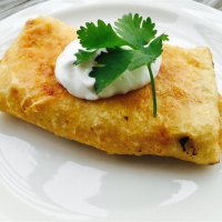 Chicken Chimichangas with Sour Cream Sauce Recipe | Allrecipes image