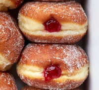 Jam doughnuts recipe | BBC Good Food image