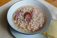 Simple Crock Pot Ham Hock and Beans | Just A Pinch Recipes image