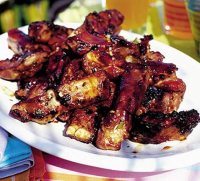 Sizzling spare ribs with BBQ sauce recipe | BBC Good Food image