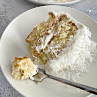 Coconut Cream Poke Cake with Coconut Whipped Cream Frosting image