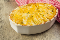 Scalloped Potatoes with Three Cheeses Recipe | Epicurious image