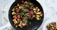 Skillet Steak with Asparagus and Potatoes Recipe - PureWow image