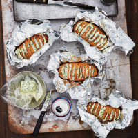Grill-Baked Potatoes with Chive Butter Recipe - Food & Wine image