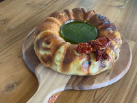Stromboli Bread Wreath Recipe | Jeff Mauro | Food Network image