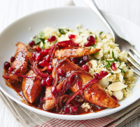 Pomegranate chicken with almond couscous - BBC Good Food image
